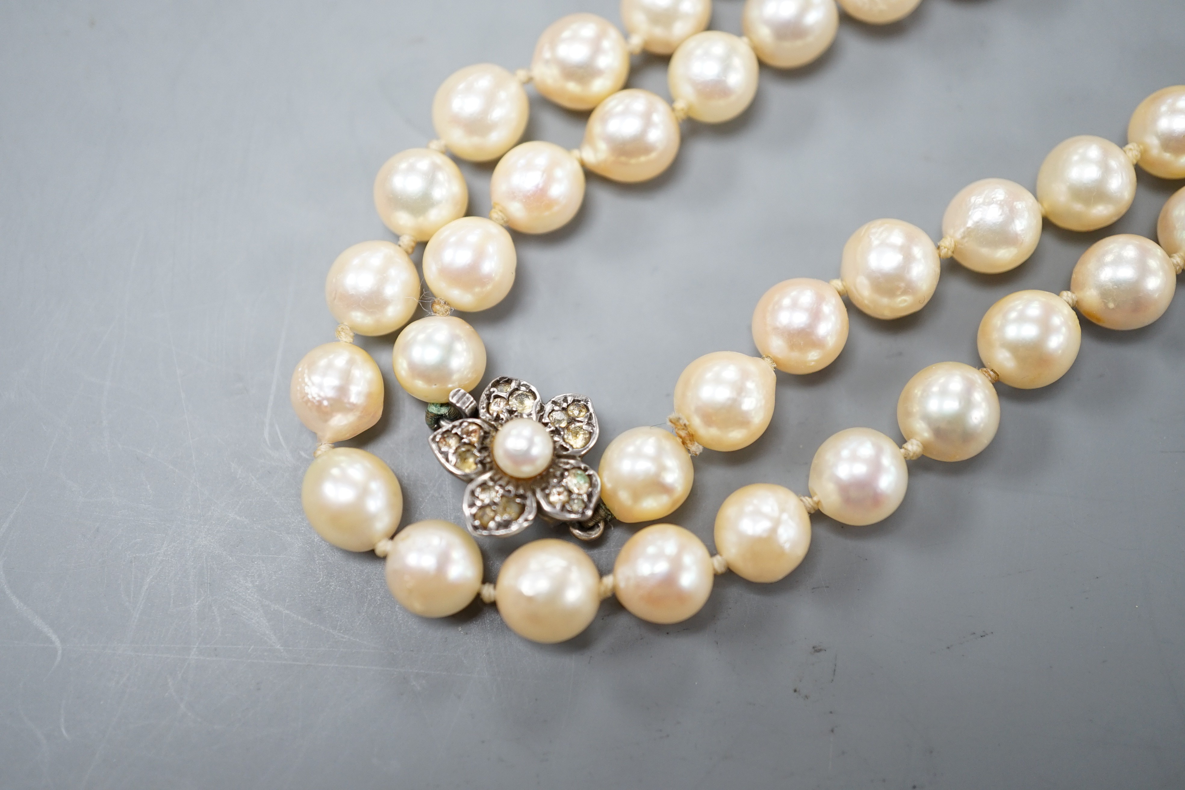 A single strand culture pearl necklace with cultured pearl set sterling clasp, 74cm.